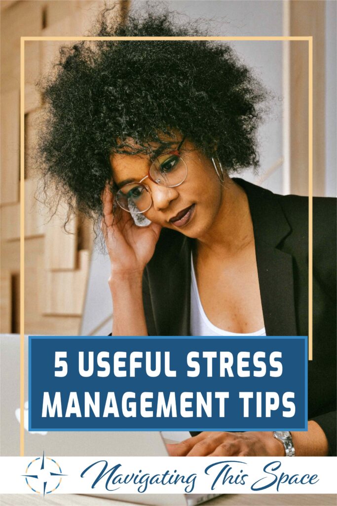 Black woman with afro hair gazes at her laptop, manage stress with these easy steps