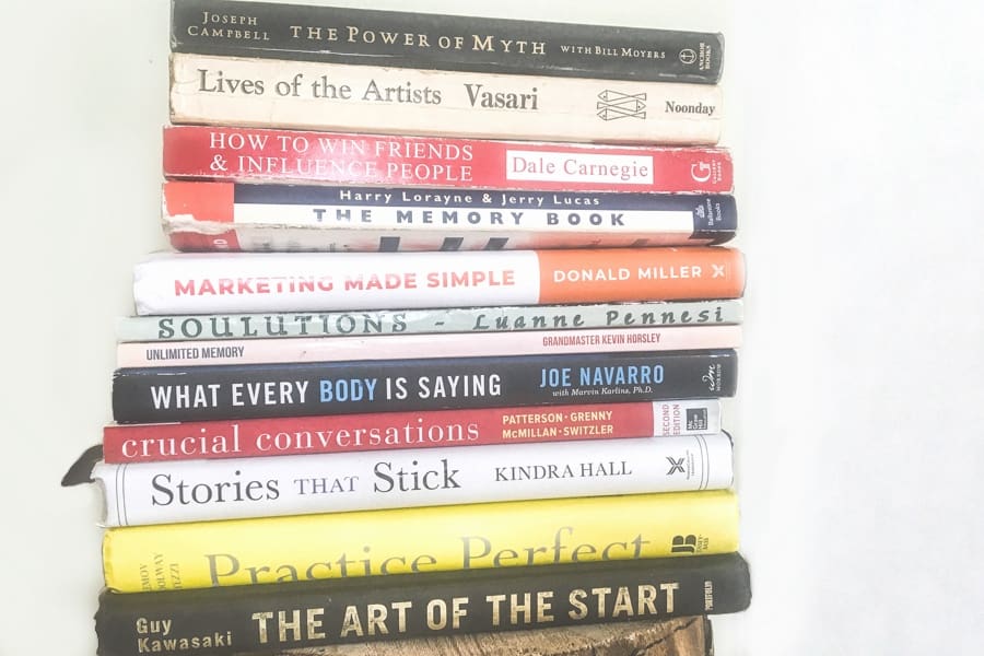 A stack of twelve books to read on a reading challenge