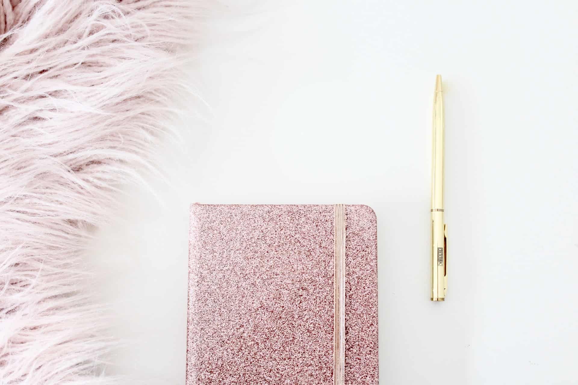 pink fur and sparking journal notebook with a golden pen