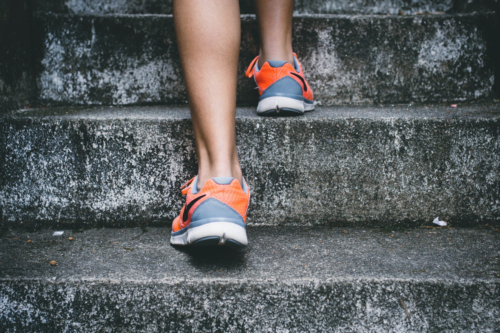 feet running up some stairs representing a healthy mind in a healthy body attitude.