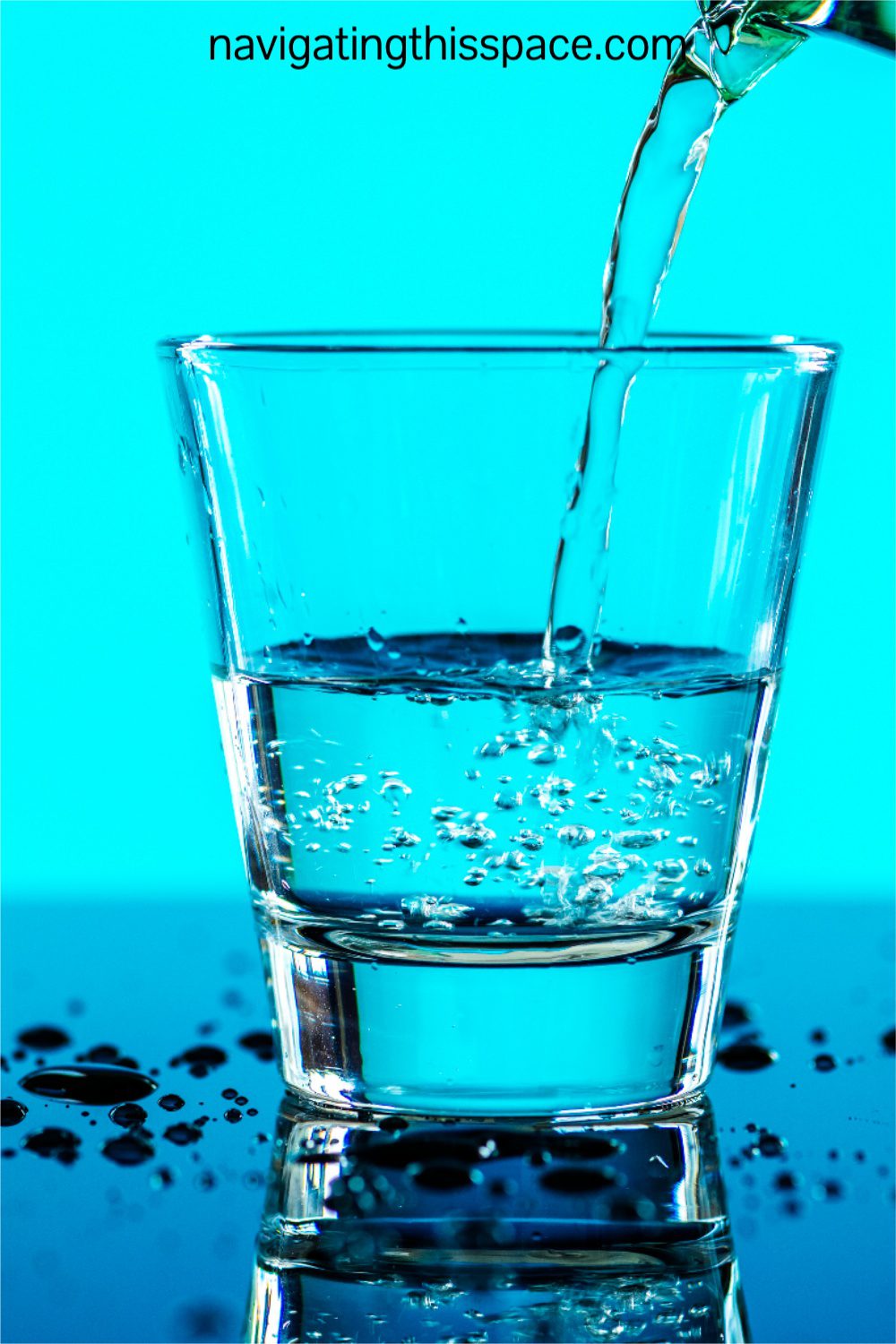 glass of water being filled reminding you to stay healthy by drinking water