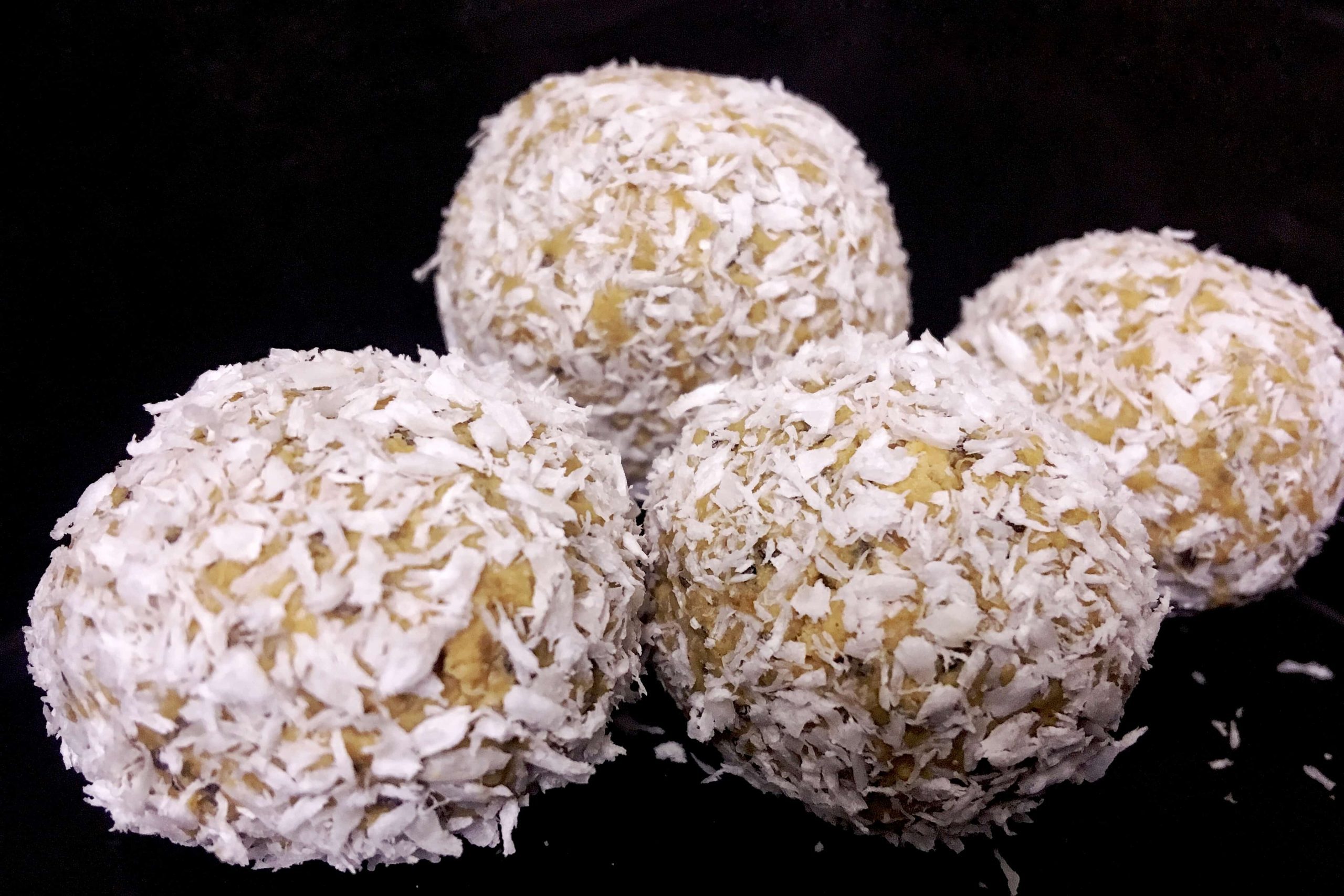 No bake energy balls covered in coconut flakes is a great healthy vegan snacks