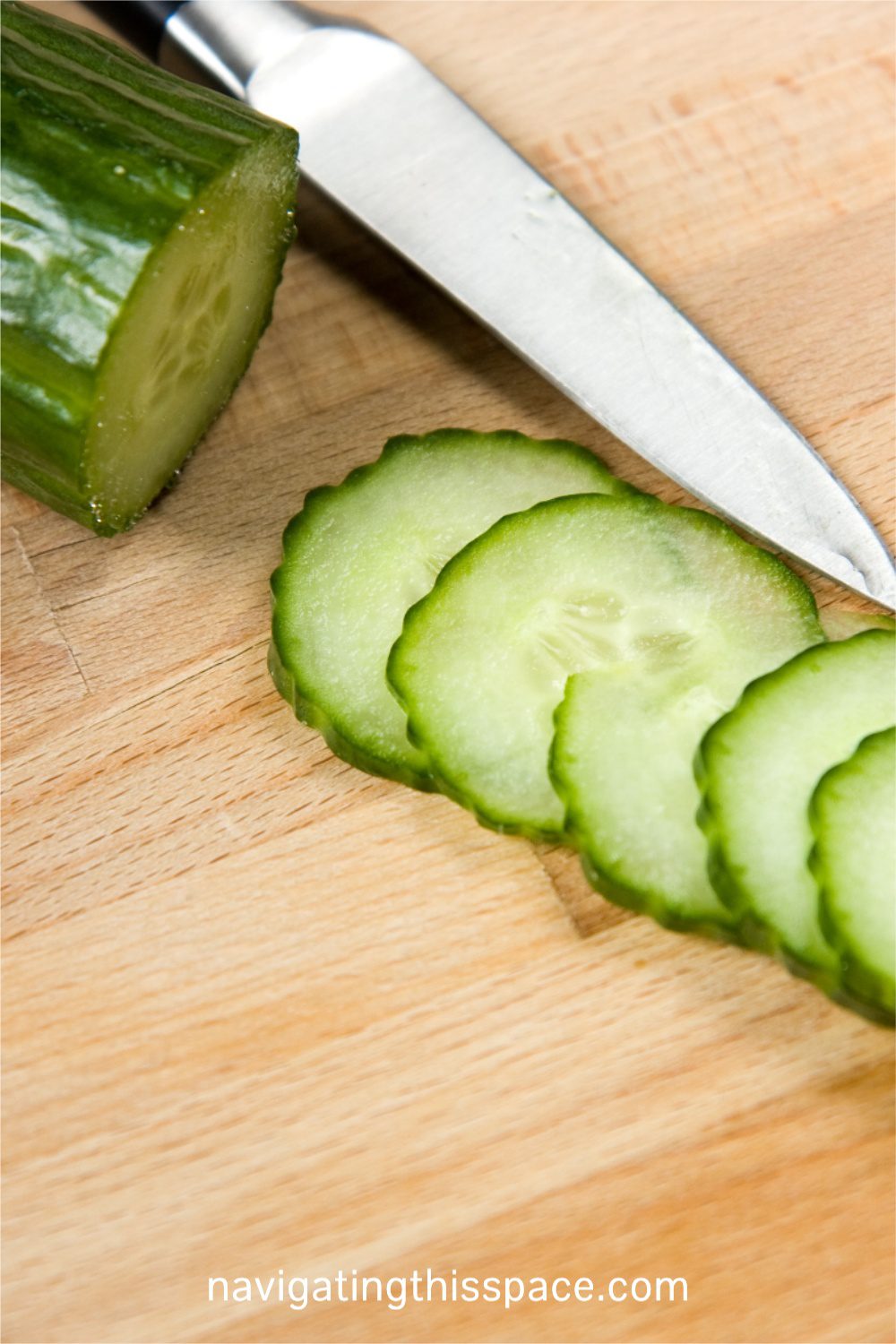 hydrating vegetable sliced cucumber on a cutting board with a knife is another way to drink more water