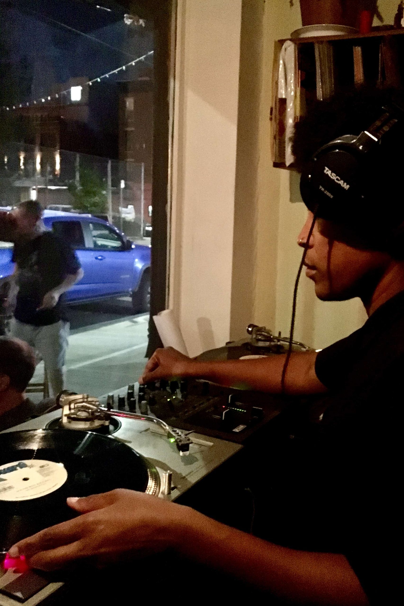 Dj playing vinyl records at The Record Shop in Red Hook New York