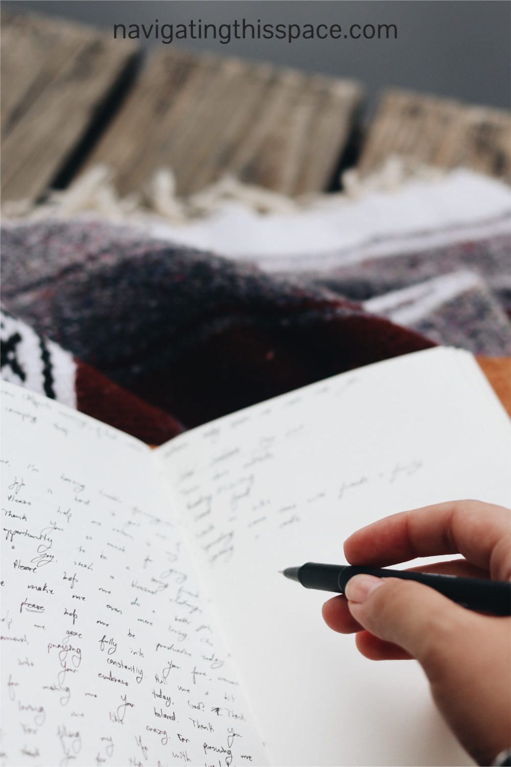 a hand writing in a journal using the tips for daily journaling