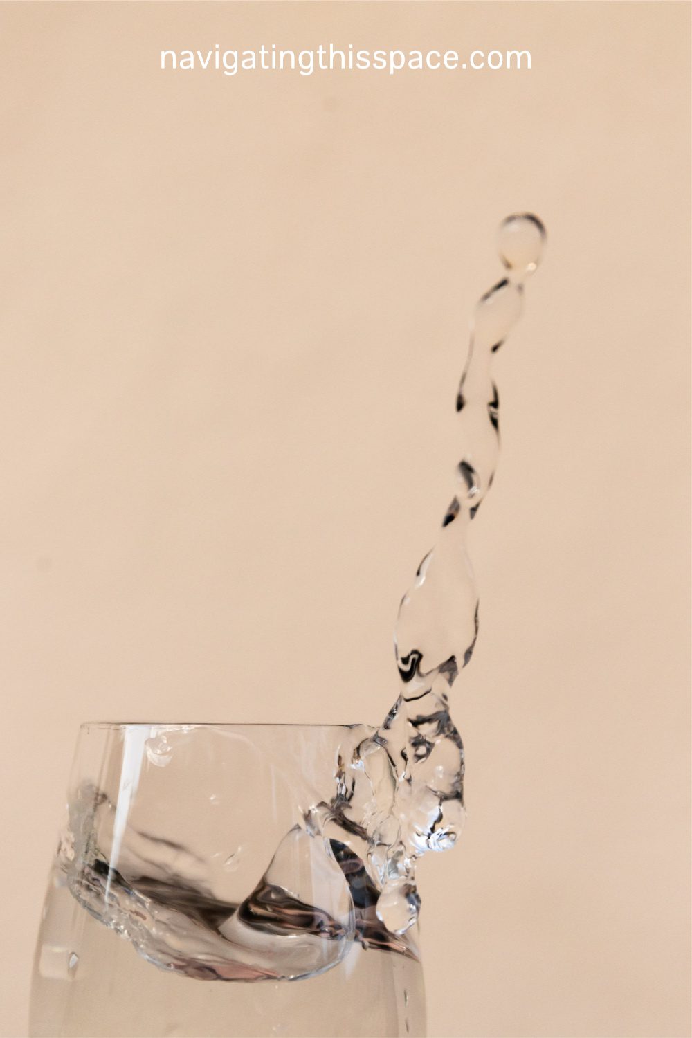 water splashing in a drinking glass