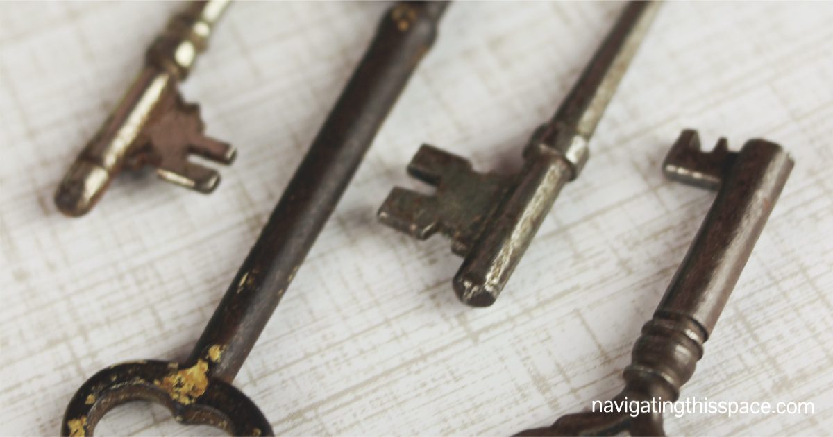 four retro keys laying on a table