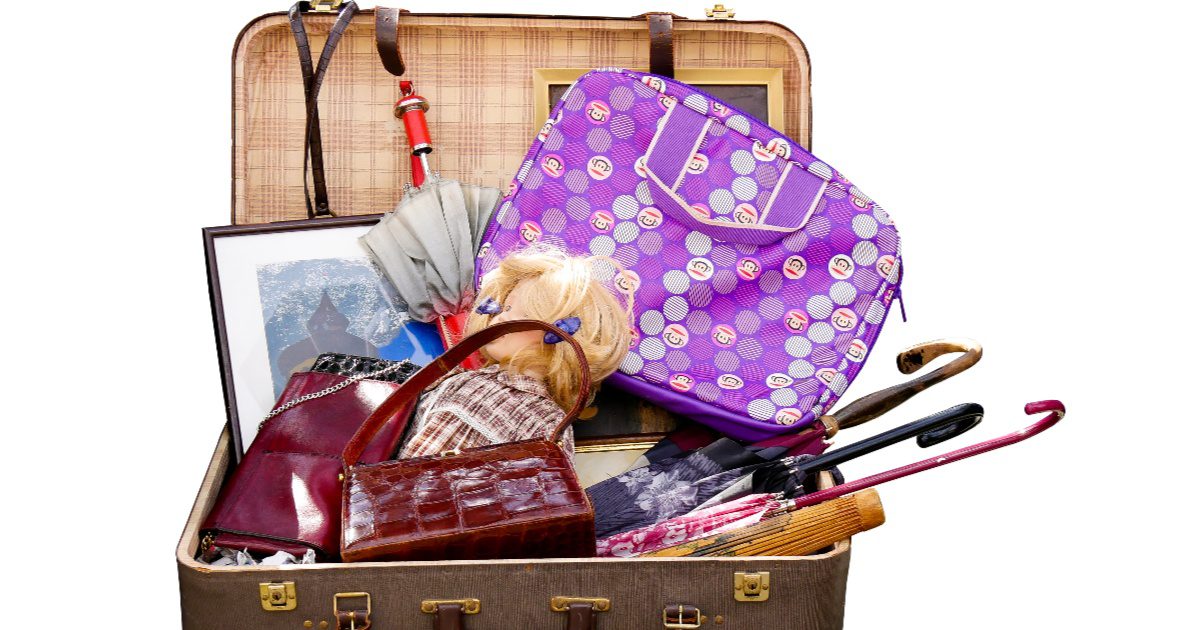 An overflowing luggage with unnecessary items for a trip a