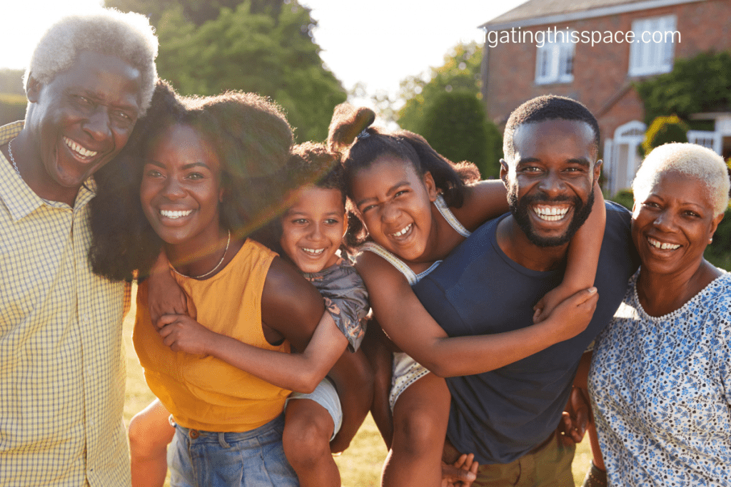 A picture of black family members all smiles at a family reunion