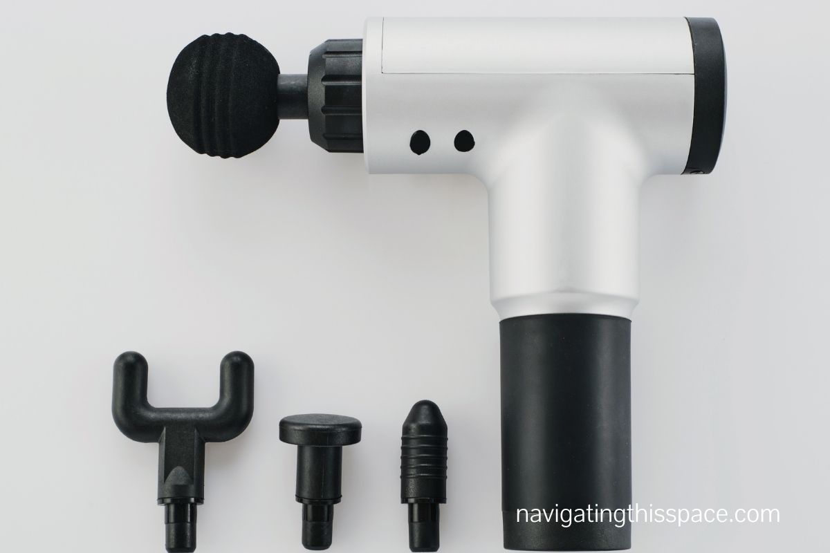 massage gun with different attachment heads