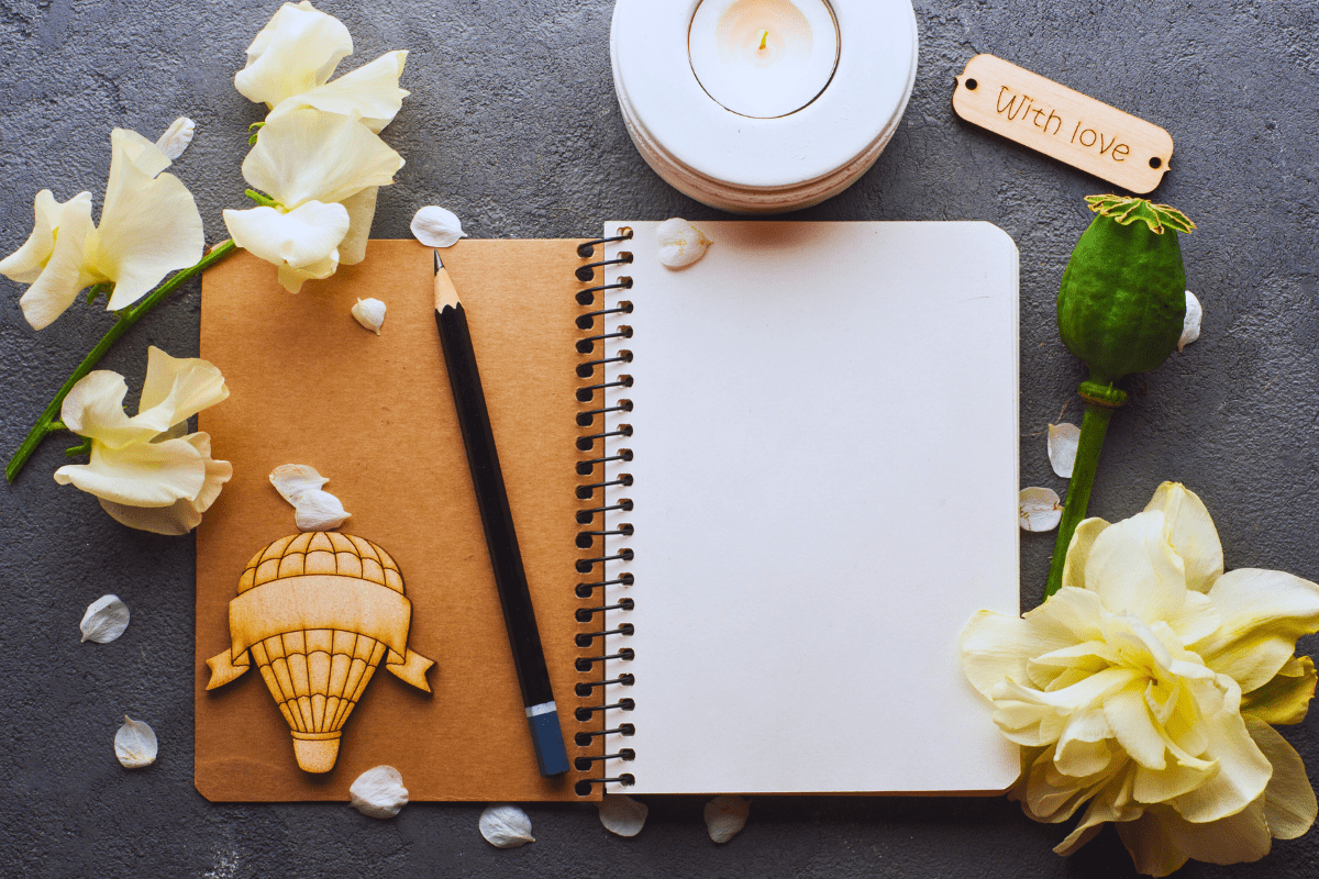 pencil placed on a spiral notebook